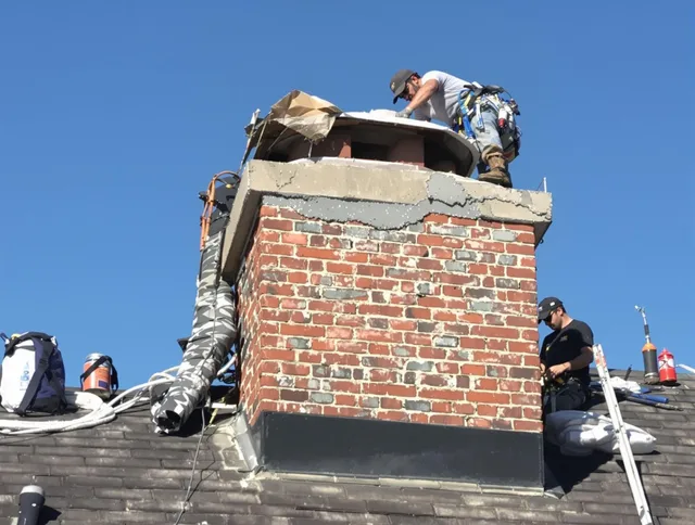 Fort Myers Chimney Sweep installing a custom chimney crown in Fort Myers, FL
