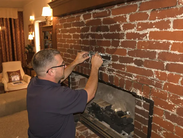 Fort Myers Chimney Sweep expert fixing a fireplace in Fort Myers, FL